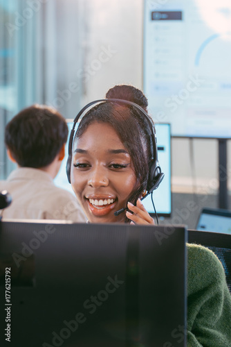 Focused Female Call Center Specialist Sitting at Desk with Headset. Professional Customer Service Agent Talking to Client, Providing Online Assistance, Technical Support, Helpline, CRM Support office