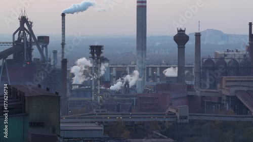 Aerial drone view of Industrial steel factory, iron works. Metallurgical plant. steelworks. Heavy industry in Europe, Poland, Dabrowa Gornicza. Air pollution from chimneys. Ecology and environmental