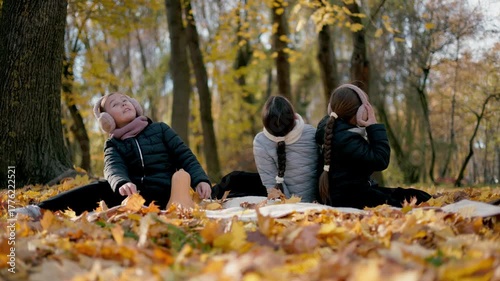 Happiness is in simple things: a sunny autumn day, music in headphones and carefree smiles of happy children. Autumn has its own soundtrack.