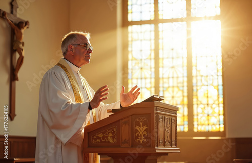 Senior priest speaks from pulpit in sunlight. Pastor preaches sermon inside church for christianity. Religious male gives speech. Man shares message of faith, spiritual guidance at prayer service