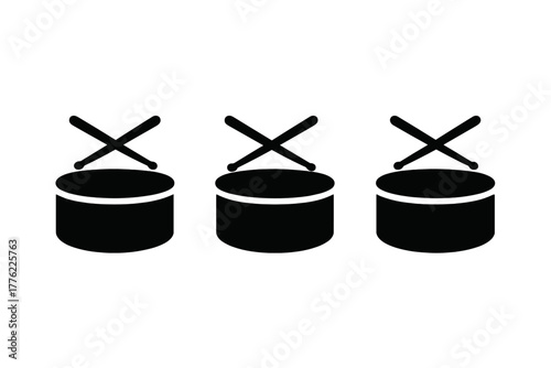 Drums arranged in a row with crossed drumsticks silhouetted against a plain background