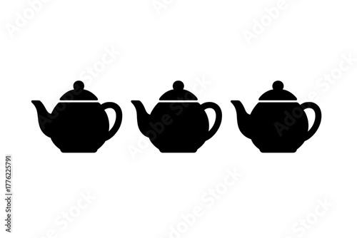 Three black teapots arranged in a row for display in a minimalistic design setting