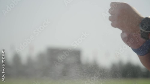 Female hands of a professional athlete shake off white sports powder
