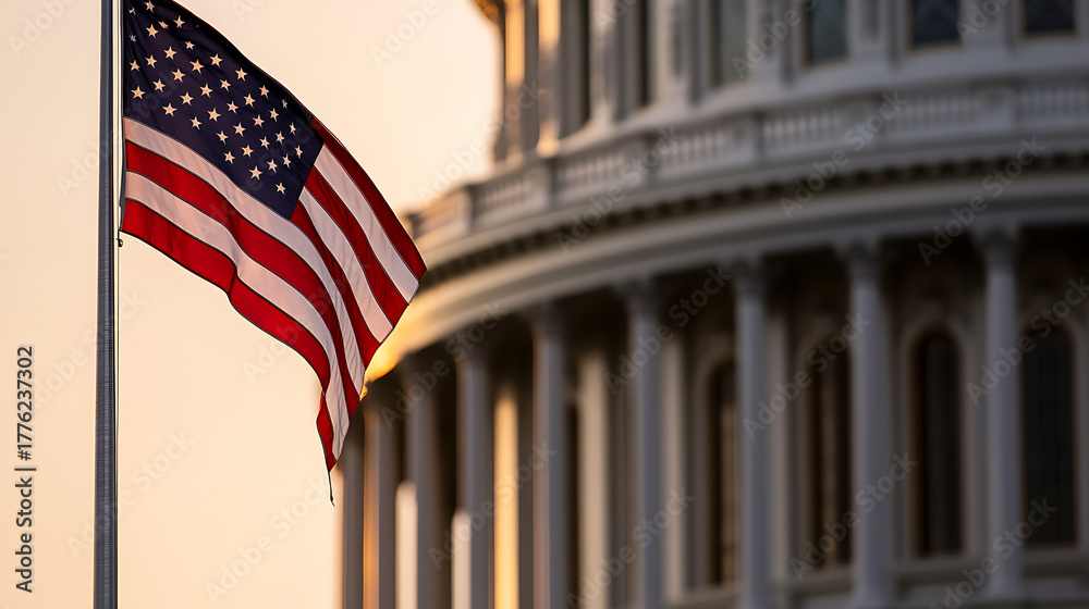 Fototapeta premium Majestic view of the nation's Capitol building at golden hour, with a waving flag of the United States symbolizing patriotism, government, and historical landmarks.