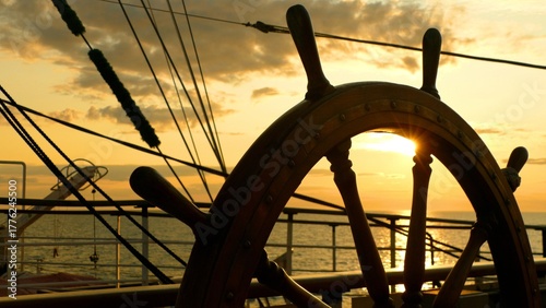 sunset through an antique ship's wheel