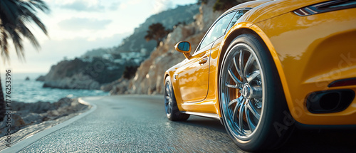Yellow sports car driving along a scenic coastal highway.