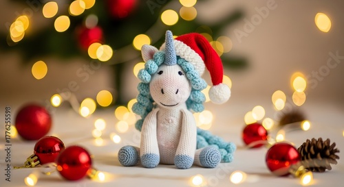 Cute unicorn toy wearing a santa hat with festive christmas lights and ornaments