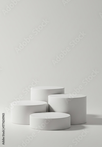 Four white round podiums isolated on white background for product display, a minimal, modern display platform (dais/pedestal) for product or presentation visuals