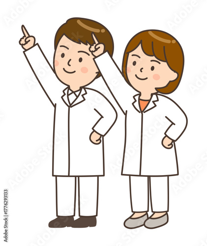 腰に手を当てて斜め上を指さす若い男女の医師
