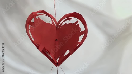 conceptual representation for the romantic festival involving a crimson cardiac silhouette form carefully excised from