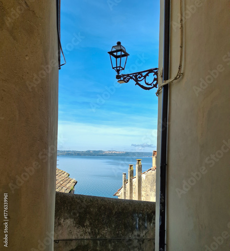 evocative glimpse of the sea between the alleys of the village