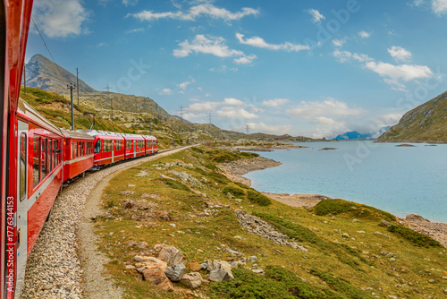 Bernina Express glides from Tirano to St. Moritz, treating passengers to panoramic alpine landscapes and charming villages. Stunning views make this one of the most scenic train journeys in the world