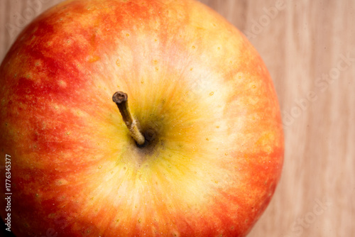 close up red apple on a wooden table