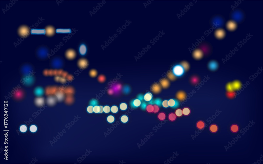 Blurred lights of a night city in a bokeh style against a dark blue background.