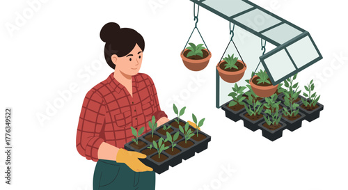Gardener with seedlings in greenhouse with hanging pots