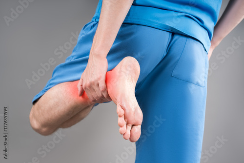 Achilles tendon injury, joint inflammation, foot pain, man suffering from feet ache, podiatry concept
