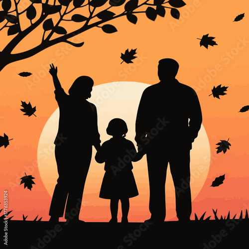 Silhouette of a man with two children holding hands at sunset with autumn leaves falling around them
