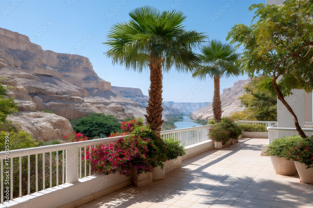 Fototapeta premium Terrace overlooking river, canyon and palm trees on sunny day