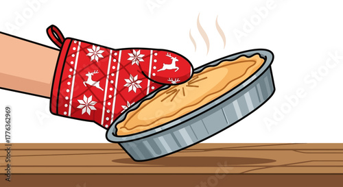 A hand wearing a festive red Christmas oven mitt holding a hot, steaming pie in a metal dish over a wooden table.