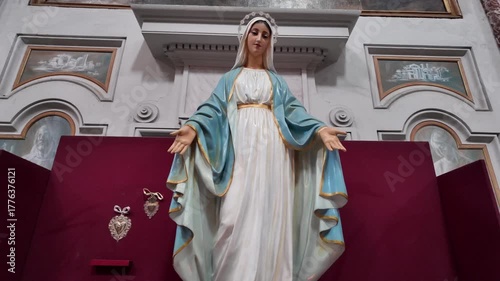 A statue of the Virgin Mary captures the serene beauty and divine compassion