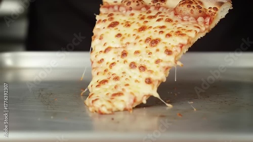 Pizza Slice with Cheese on Baking Tray.