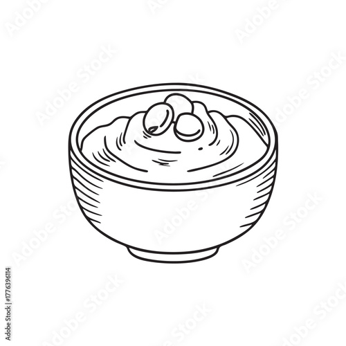 Bowl of creamy fava bean puree with olive oil drizzle