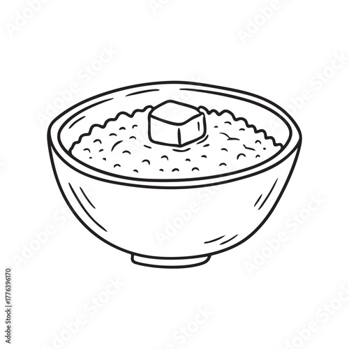 Bowl of grain porridge topped with melted butter