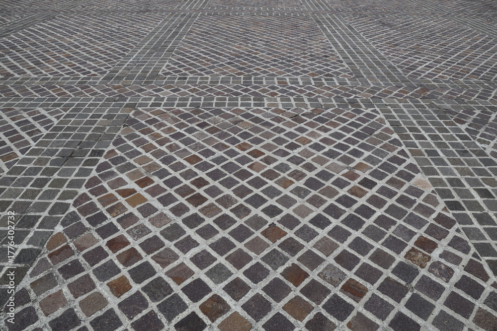 Obraz premium Modern grey gray brown city urban square floor texture background, long angle perspective view. modern tile tiled stone street road pavement texture pattern.