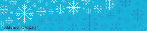 New Year snowflakes on a blue background, falling snow, Christmas and holiday	