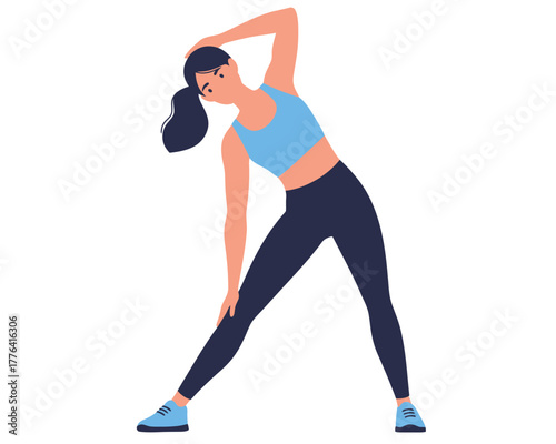 Young athletic woman with dark ponytail performing a side bend stretch exercise in a bright blue sports bra and dark leggings