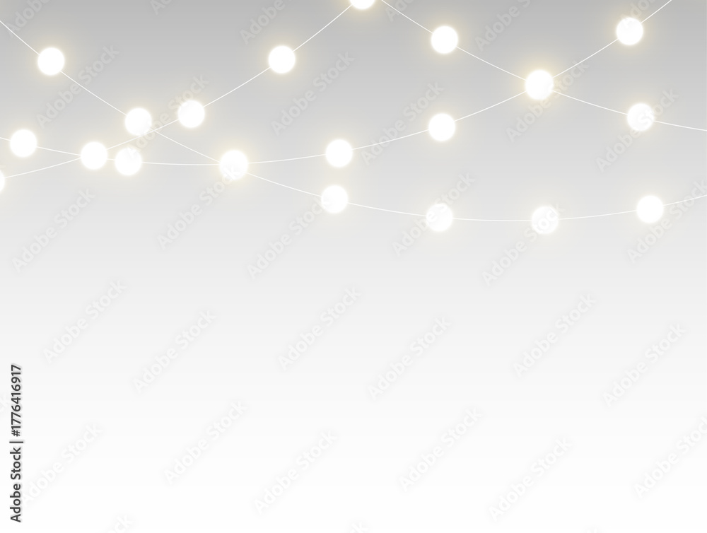 Obraz premium Golden christmas garland glowing with bright festive lights and decorative chain illumination creating a transparent horizontal border perfect for winter holiday cards, banners, and celebration design