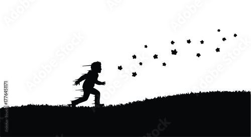 Joyful child running uphill, chasing scattered leaves in a silhouette against a bright sky.