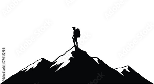 Lone hiker celebrates reaching the summit of a majestic mountain peak.
