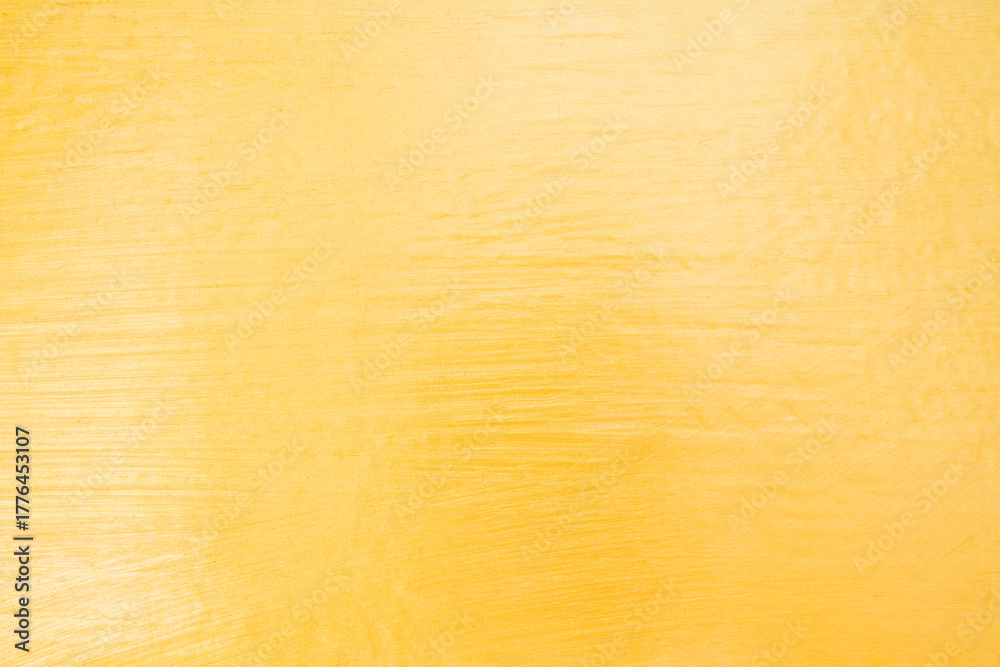 Fototapeta premium Gold color cement wall texture background.