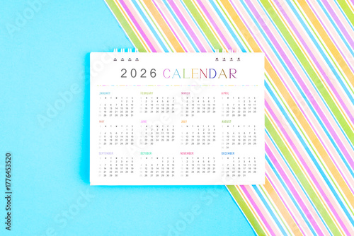 2026 desk calendar on colorful background.