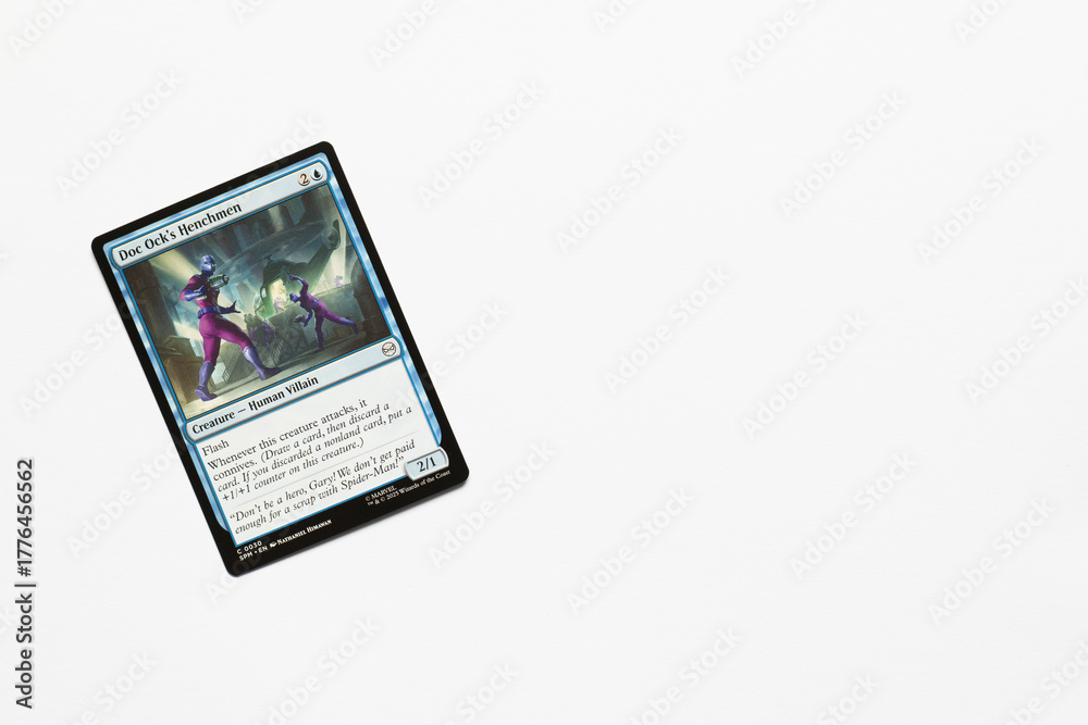 Naklejka premium Bradford, UK Nov 3 2025 Doc Ock's Henchmen magic the gathering card shot isolated on a white paper background.