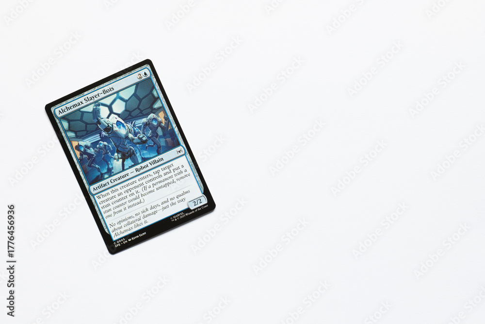Obraz premium Bradford, UK Nov 3 2025 Alchemax Slayer-Bots card from the Spider-man magic the gathering card game shot isolated on a white paper background.