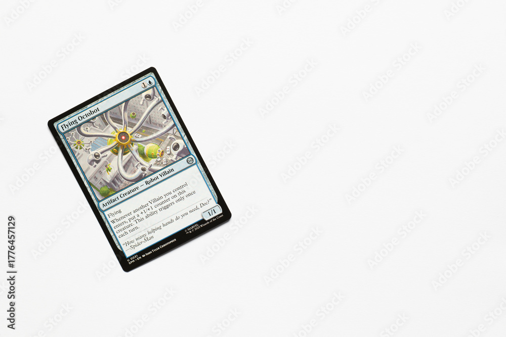 Naklejka premium Bradford, UK Nov 3 2025 Flying Octobot card from the Spider-man magic the gathering card game shot isolated on a white paper background.