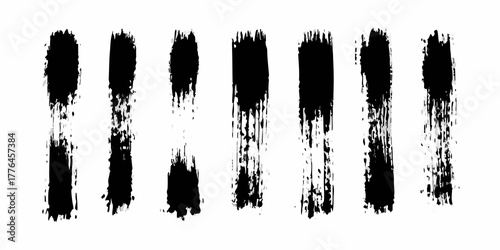 Collection of textured black brush strokes on a white background