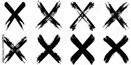 Collection of eight black grunge x marks hand drawn brush strokes on white background
