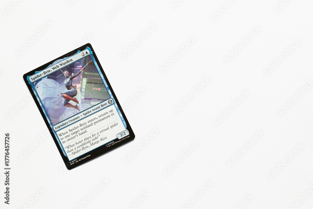Naklejka premium Bradford, UK Nov 3 2025 Spider-Byte, Web Warden card from Spider-man magic the gathering card game shot isolated on a white paper background.