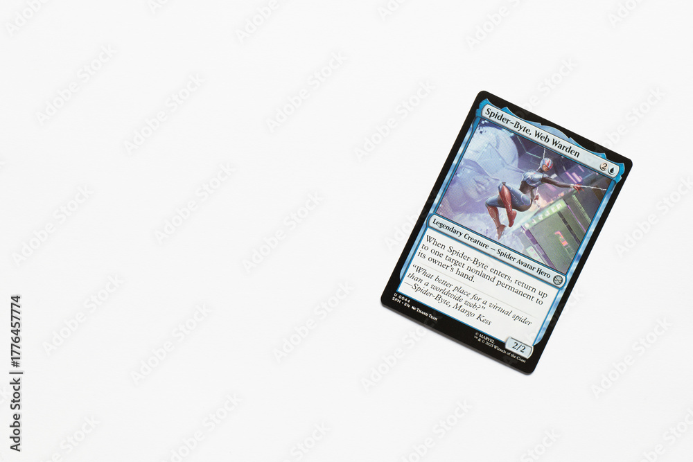 Obraz premium Bradford, UK Nov 3 2025 Spider-Byte, Web Warden card from Spider-man magic the gathering card game shot isolated on a white paper background.