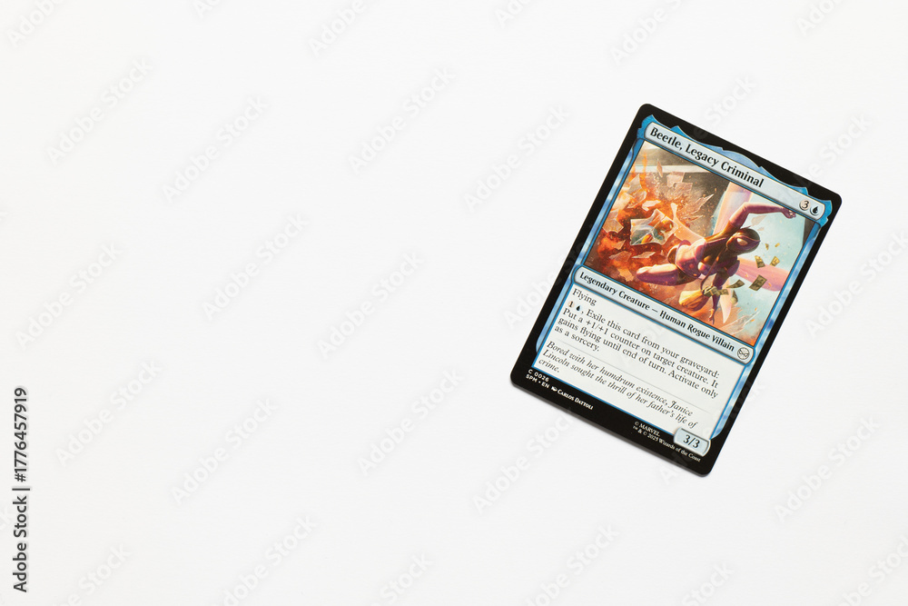 Obraz premium Bradford, UK Nov 3 2025 Beetle, Legacy Criminal card from Spider-man magic the gathering card game shot isolated on a white paper background.
