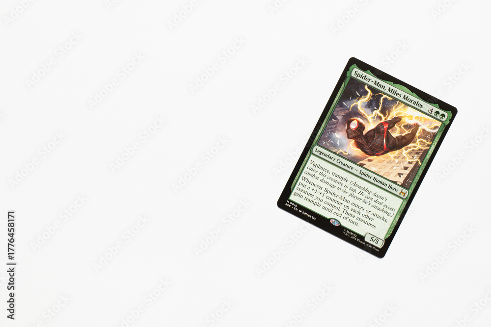 Obraz premium Bradford, UK Nov 3 2025 Spider-man, Miles Morales card from the Spider-man magic the gathering card game shot isolated on a white paper background.