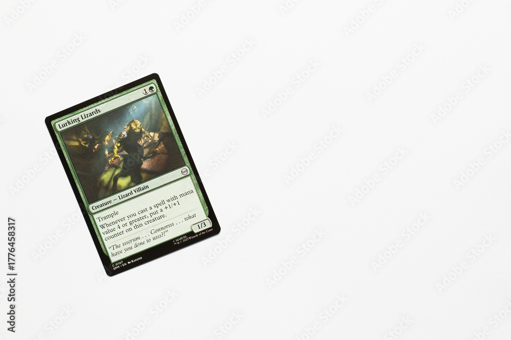 Fototapeta premium Bradford, UK Nov 3 2025 Lurking Lizards card from Spider-man magic the gathering card game shot isolated on a white paper background.