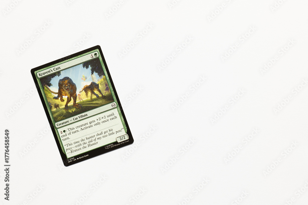 Obraz premium Bradford, UK Nov 3 2025 Kraven's Cats card from Spider-man magic the gathering card game shot isolated on a white paper background.
