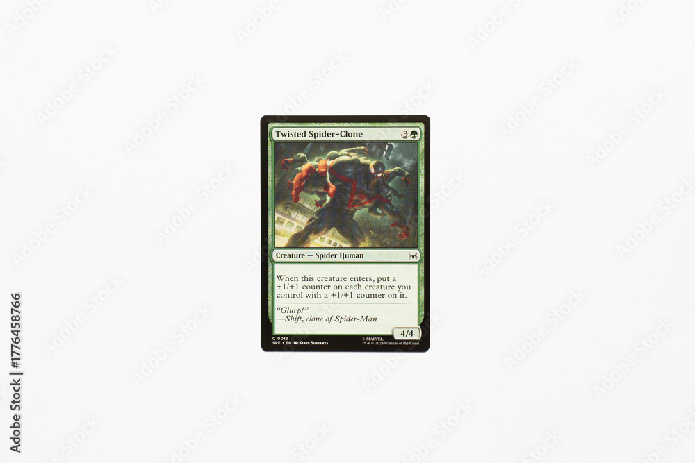 Naklejka premium Bradford, UK Nov 3 2025 Twisted Spider-clone card from Spider-man magic the gathering game shot isolated on a white paper background.