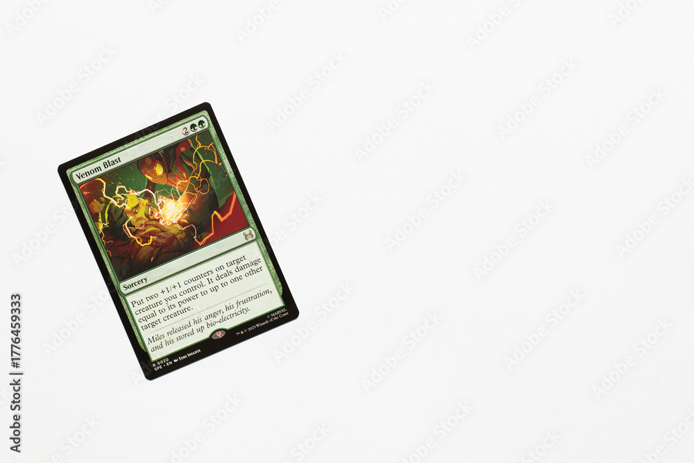 Obraz premium Bradford, UK Nov 3 2025 Venom Blast card from Spider-man magic the gathering shot isolated on a white paper background.
