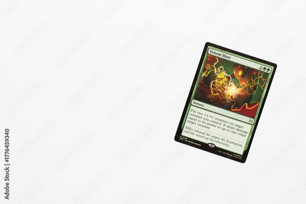 Obraz premium Bradford, UK Nov 3 2025 Venom Blast card from Spider-man magic the gathering shot isolated on a white paper background.