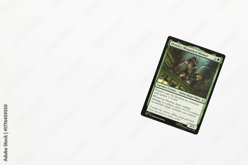 Naklejka premium Bradford, UK Nov 3 2025 Prowler Misguided Mentor card from Spider-man magic the gathering shot isolated on a white paper background.